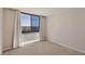 A bright and airy bedroom features a large window with natural light at 3930 University Center Dr # 804, Las Vegas, NV 89119