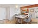 Dining area with stylish modern furniture set and view to the kitchen at 3930 University Center Dr # 804, Las Vegas, NV 89119