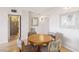 Bright dining area features a round wood table and four upholstered chairs at 3930 University Center Dr # 804, Las Vegas, NV 89119