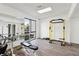 Bright gym with large windows, gym equipment, wood-style floors and large mirrors at 3930 University Center Dr # 804, Las Vegas, NV 89119