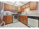 Well-maintained kitchen with stainless steel appliances, wood cabinets, and tile floors at 3930 University Center Dr # 804, Las Vegas, NV 89119