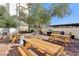 Outdoor patio area with several picnic tables and a barbecue at 3930 University Center Dr # 804, Las Vegas, NV 89119
