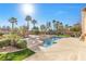 Outdoor oasis with a sparkling pool, spa, and patio area perfect for entertaining at 4024 Mansion Hall Ct, Las Vegas, NV 89129