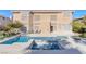 Outdoor oasis with a sparkling pool, spa, and patio area perfect for entertaining at 4024 Mansion Hall Ct, Las Vegas, NV 89129