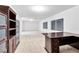Finished basement with carpet flooring, desk, and built-in shelving at 4024 Mansion Hall Ct, Las Vegas, NV 89129