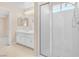 Bathroom with double vanity, shower stall, and neutral finishes at 4024 Mansion Hall Ct, Las Vegas, NV 89129