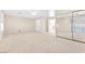 Large bedroom featuring mirrored closet doors and light colored carpet at 4024 Mansion Hall Ct, Las Vegas, NV 89129