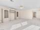 Large bedroom featuring built in shelving and light colored carpet at 4024 Mansion Hall Ct, Las Vegas, NV 89129