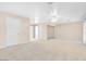 Spacious bedroom with white walls and light carpet at 4024 Mansion Hall Ct, Las Vegas, NV 89129