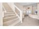 Foyer with carpeted staircase with glass and white railing plus a double door entryway at 4024 Mansion Hall Ct, Las Vegas, NV 89129