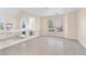 Living room with tile floors and multiple windows at 4024 Mansion Hall Ct, Las Vegas, NV 89129