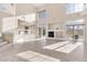 Open living room featuring tile floors, a fireplace, large windows and glass sliding doors at 4024 Mansion Hall Ct, Las Vegas, NV 89129