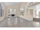 Expansive living room featuring a fireplace and large windows, creating a warm and inviting atmosphere at 4024 Mansion Hall Ct, Las Vegas, NV 89129