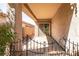 Covered patio with iron gate, sliding glass door, and neutral colors at 4125 Gliding Gulls Ave, North Las Vegas, NV 89084