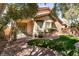 Charming backyard featuring lush greenery, decorative rock landscaping, and a cozy patio area at 4125 Gliding Gulls Ave, North Las Vegas, NV 89084