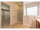 Bathroom featuring walk-in shower, walk-in tub and a large tile flooring at 4125 Gliding Gulls Ave, North Las Vegas, NV 89084