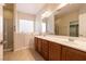 Bathroom with double sinks, a walk-in shower, a walk-in tub and neutral color scheme at 4125 Gliding Gulls Ave, North Las Vegas, NV 89084