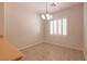 Dining area with tile floors, recessed lights, window with shutters, and modern chandelier at 4125 Gliding Gulls Ave, North Las Vegas, NV 89084
