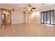 Bright living room with tile flooring, natural light, ceiling fan, and recessed lighting at 4125 Gliding Gulls Ave, North Las Vegas, NV 89084