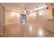 Spacious living room with tile flooring, fan, large windows, and ample natural light at 4125 Gliding Gulls Ave, North Las Vegas, NV 89084