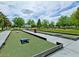 Outdoor recreational area with game space, lush trees, and well-maintained surroundings at 4125 Gliding Gulls Ave, North Las Vegas, NV 89084