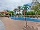 A colorful playground with playful palm tree fixtures and a sunshade at 4125 Gliding Gulls Ave, North Las Vegas, NV 89084