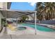 Backyard featuring a pool, hot tub, covered patio, and lush landscaping at 4330 Flandes St, Las Vegas, NV 89121