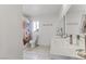 Bright bathroom with double vanity, modern fixtures, and a shower with a colorful curtain at 4330 Flandes St, Las Vegas, NV 89121