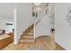Bright entryway showcases a curved staircase with hardwood floors and an open floor plan at 4330 Flandes St, Las Vegas, NV 89121