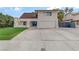 Charming two-story home with a well-maintained lawn and a spacious driveway at 4330 Flandes St, Las Vegas, NV 89121