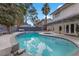 Backyard features a sparkling pool with a covered patio, offering an ideal outdoor living space at 4330 Flandes St, Las Vegas, NV 89121
