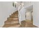 Staircase with wooden stairs and white railing, leading to the upper level of the house at 4330 Flandes St, Las Vegas, NV 89121