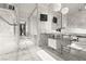 Modern bathroom with dual sinks, marble countertop, and mounted TV, showcasing contemporary design and luxury finishes at 4381 W Flamingo Rd # 922, Las Vegas, NV 89103