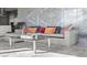 Comfortable living room setup with stylish sofa, colorful pillows, and a glass coffee table, perfect for relaxation at 4381 W Flamingo Rd # 922, Las Vegas, NV 89103