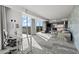Open-plan living room with floor to ceiling windows offering city views and a modern workspace at 4381 W Flamingo Rd # 922, Las Vegas, NV 89103