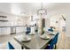 Elegant dining area connected to kitchen, featuring stylish table setting and modern lighting at 4471 Wisconsin Ave, Las Vegas, NV 89104