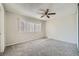Bedroom with a ceiling fan, window with blinds, and neutral carpet at 4495 Park View Dr, Las Vegas, NV 89104