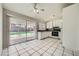 Eat-in kitchen features sliding glass doors to backyard, white cabinets, and modern appliances at 4495 Park View Dr, Las Vegas, NV 89104
