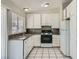 Bright kitchen featuring white cabinets, granite countertops, and stainless steel appliances at 4495 Park View Dr, Las Vegas, NV 89104