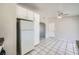 Bright kitchen with white cabinets, white appliances, tile floors, and neutral paint at 4495 Park View Dr, Las Vegas, NV 89104