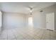 Spacious living room with tile flooring, ceiling fan, and neutral paint at 4495 Park View Dr, Las Vegas, NV 89104