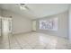 Bright living room featuring tile floors, a ceiling fan, and neutral paint at 4495 Park View Dr, Las Vegas, NV 89104