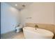 Modern bathroom with a freestanding soaking tub and tile flooring at 4525 Dean Martin Dr # 2001, Las Vegas, NV 89103