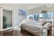 Modern bedroom features a large window with city views, and a sliding glass door at 4525 Dean Martin Dr # 2001, Las Vegas, NV 89103