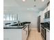 Modern kitchen with stainless steel appliances, sleek countertops, and bar seating area at 4525 Dean Martin Dr # 2001, Las Vegas, NV 89103