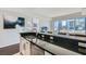 Contemporary kitchen with sleek countertops, white cabinetry, and open view to the living area at 4525 Dean Martin Dr # 2001, Las Vegas, NV 89103
