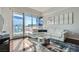 Bright living room featuring modern decor, a comfortable white sofa, and expansive windows with city views at 4525 Dean Martin Dr # 2001, Las Vegas, NV 89103