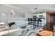 Open-concept living and kitchen area with a stylish white sofa and modern bar seating at 4525 Dean Martin Dr # 2001, Las Vegas, NV 89103