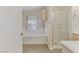 Bright bathroom featuring a separate shower and bathtub, vanity, and a window that adds natural light to the space at 4629 Cattleman Ave, North Las Vegas, NV 89031