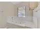 Bathroom featuring a jacuzzi tub under a window at 4629 Cattleman Ave, North Las Vegas, NV 89031